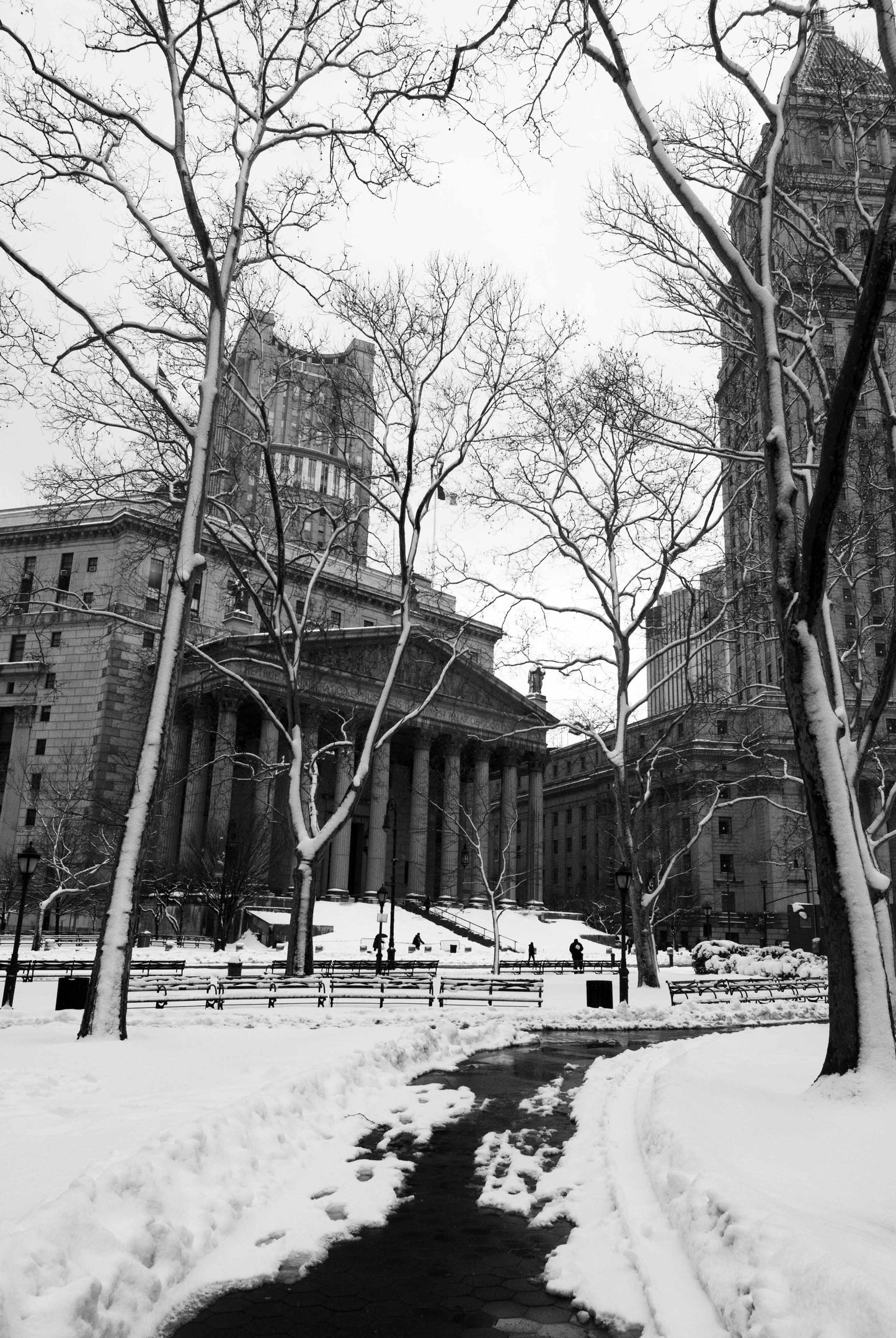 Located between Fifth Avenue and Avenue of the Americas, Manhattan, a snowy winters day in Bryant Park