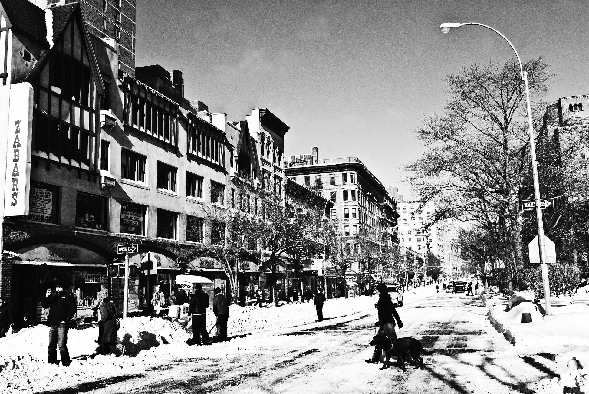 Alessandra Mattanza | CROSSING, Upper West Side, New York. Zabars deli, the Upper West Side on a winters day. Available as a photographic print on acrylic glass.
