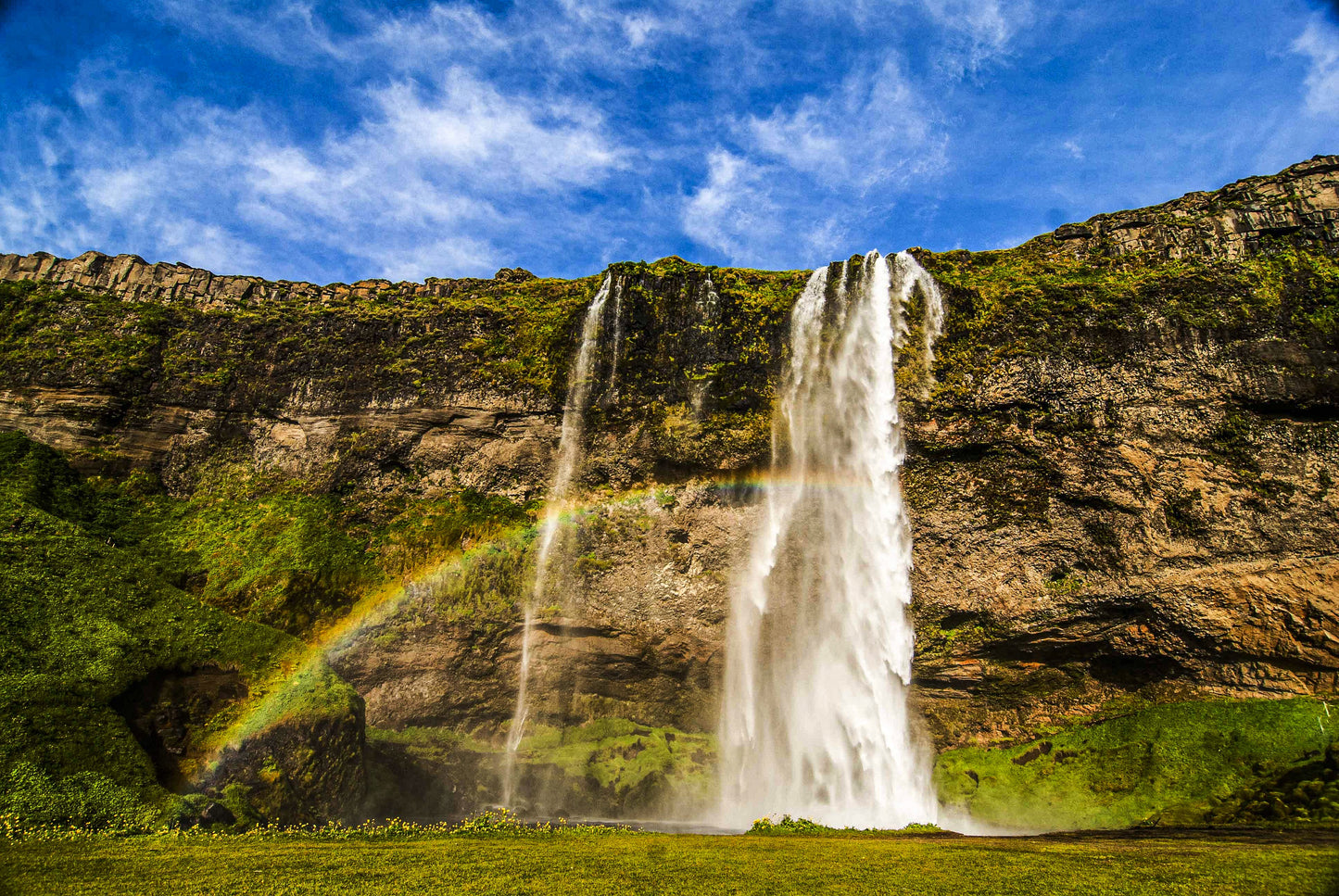 Alessandra Mattanza | FAIRY RAINBOW, Iceland. The mists of an Icelandic waterfall gives rise to a spectacular rainbow. Available as an art print or as a photographic print on acrylic glass.